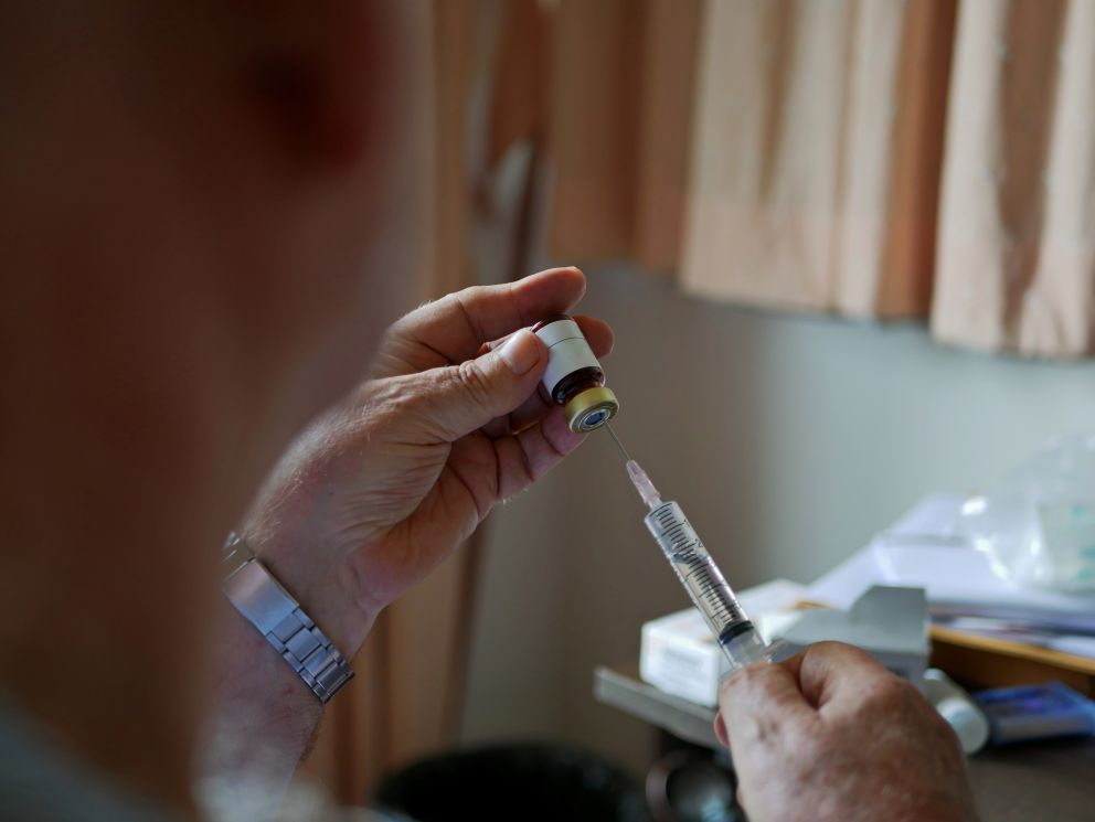 person administering self-injection